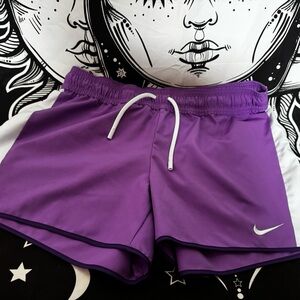 Nike Women's Purple Athletic Shorts with White Trim and Drawstring